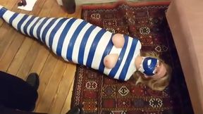Duct tape mummy girl struggles through apartment