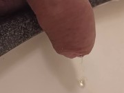 close up pee in sink. uncutted
