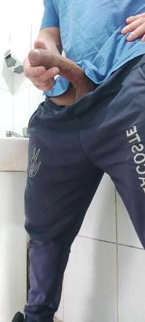 A Well-endowed Brazilian Man Urinating and Showing His Thick Penis to His Female Friends.