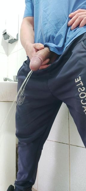 A Well-endowed Brazilian Man Urinating and Showing His Thick Penis to His Female Friends.