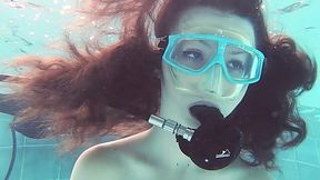 Emi Serene swims naked under the water