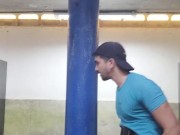 Exhibicionist latin undressing in the public bathroom