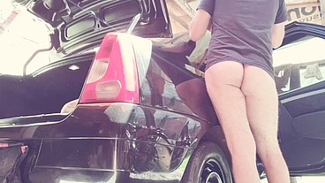 naked man cleaning car