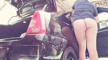 naked man cleaning car