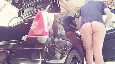 naked man cleaning car