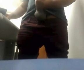 Brazilian Daddy Strokes His Big Uncut Cock at Work