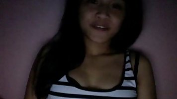 Ha Vy is charming VIetnamese teen who is striping he clothes and masturbate for the camera