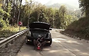 Bella slut anal fisting in street behind a car