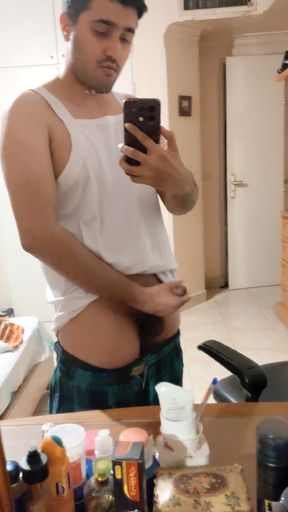 The Iranian boy shows him in front of the mirror and squeezes