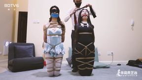 two chinese girls tied with rope and gagged and knelt