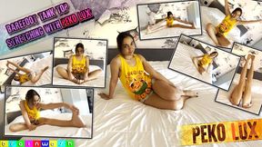 Barefoot Tank Top Peko Stretching on a Bed - MP4 (HD 1080p)