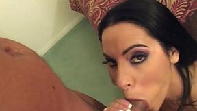 Sexy brunette MILF Veronica Raine shows off her big tits while giving a