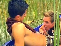 Hot boys rowing in a boat and sucking