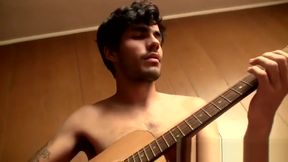 Handsome young man enjoys his guitar and jerkoff solo