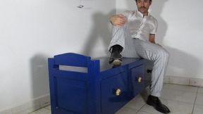Gio wearing black thin cotton dress socks after work