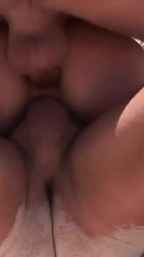 The beautiful Vittoria Risi in a scene on an exotic beach with two guys with big and hard cocks