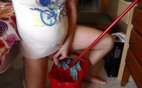 John is peeing into the cleaning bucket