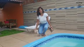 Peril in the pool in jeans, white shirt and zebra panties