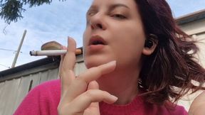 Beautiful italian milf smoking a cigarette in the garden in a sensual way 1080HD