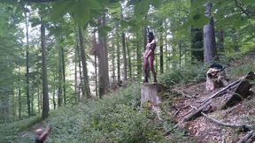 Standing pissing in a woods in a bunny mask and fishnet