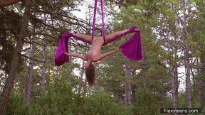Flexible Kim Nadara shows off her body while on the rope in the outdoors