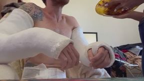 Being fed with two broken arms