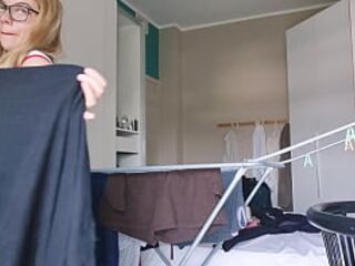 Sexually excited blond arranges her raiment with the window open and the neighbour outside sees her nude