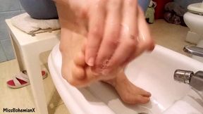 Washing extremely dirty feet - close up
