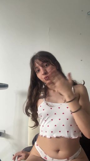 Girl in white top and red polka dots