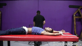 ”Handsome RT cries out in pain from the flogger in his bare flesh”