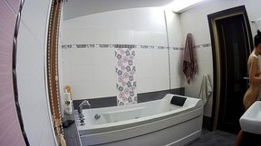 Amateur girlfriend prepares to take a bath in the bathroom