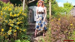 Busty babe Red XXX fingers herself in the garden