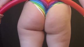 Thick white PAWG showcases her hula hooping skills at a rainbow-colored