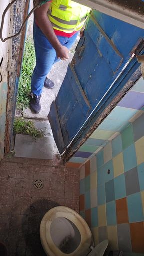 Two Construction Workers Making Out in the Company Bathroom.