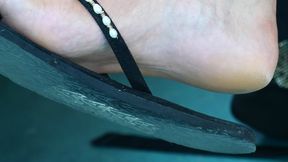 Candid flip flops dangling, strong feet, close-up foot fetish and hot bareheel soles.