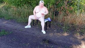 A Neighbor in the Park Undresses and Masturbates to Orgasm on a Bench