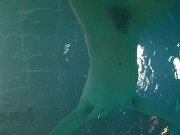 Twink loses trunks in hotel pool and swims naked