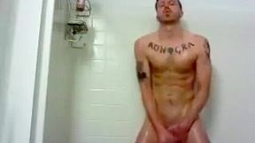 hunky tat man in shower