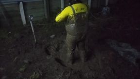 Latex Biohazard Drone Plays in Mud Pit