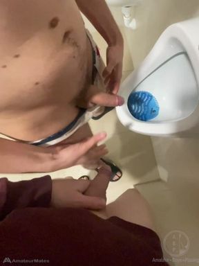 2 Boys Having Fun at the Pool Public Toilets' Urinal