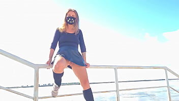 Upskirt without panties on the promenade