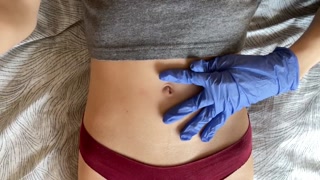 Belly button and medical gloves