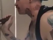 Sucking BBC at a gloryhole