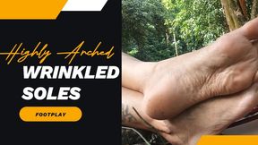 Roxan plays with her feet in flip-flops surrounded by nature (3)