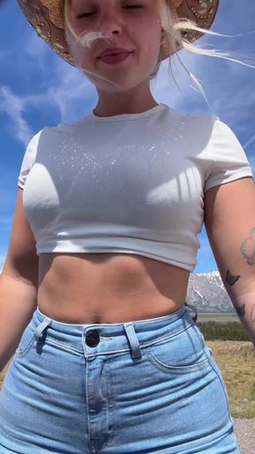 Blonde girl in crop top and jeans