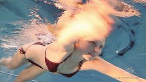 Cute Russian chick Nastya shows striptease under the water