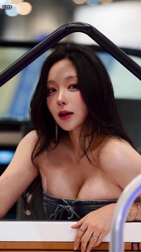 Korean babe shows off her cleavage
