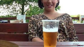 Eager brunette blowing cock in openair