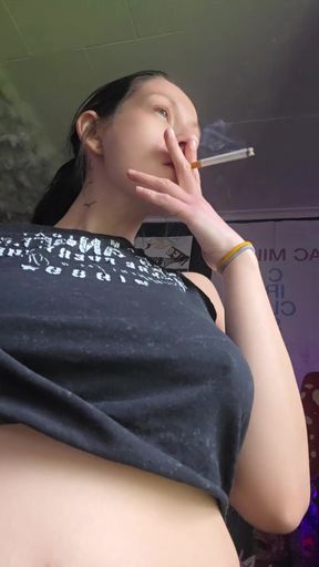 Big-titted babe smokes on cam for fans