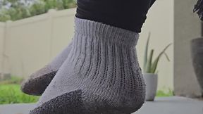 Swinging with dirty feet in dirty socks!